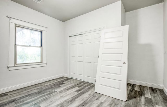 12647 E Clarkson Ave, Kingsburg, CA 93631 - unfurnished bedroom featuring light hardwood / wood-style floors and a closet