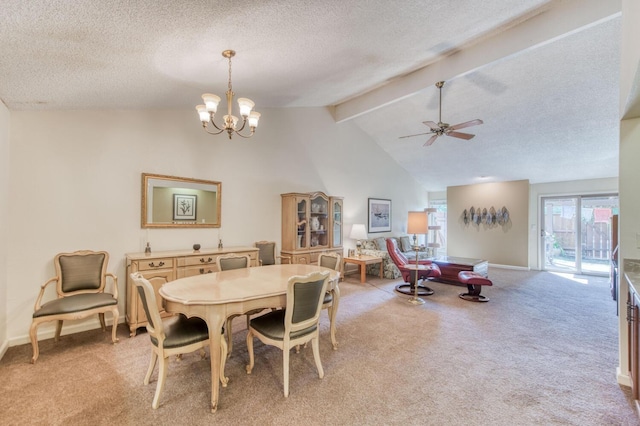 carpeted dining room featuring a textured ceiling, ceiling fan with notable chandelier, and lofted ceiling with beams