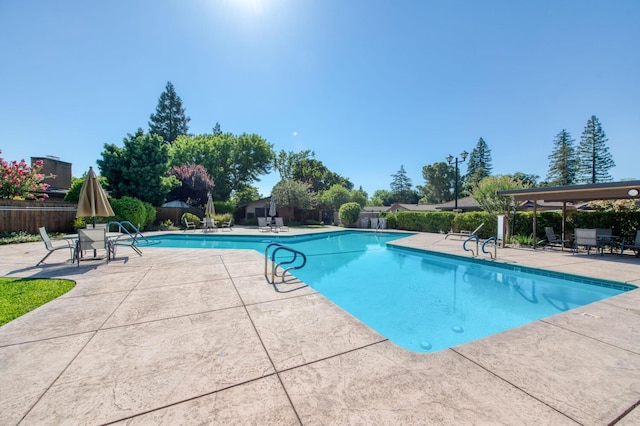 view of swimming pool featuring a patio area