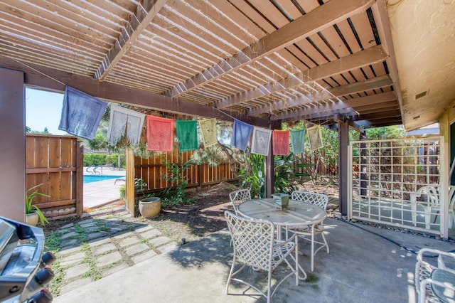 view of patio featuring a pergola and a fenced in pool