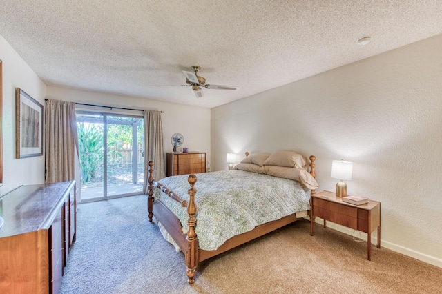 carpeted bedroom with access to outside, a textured ceiling, and ceiling fan