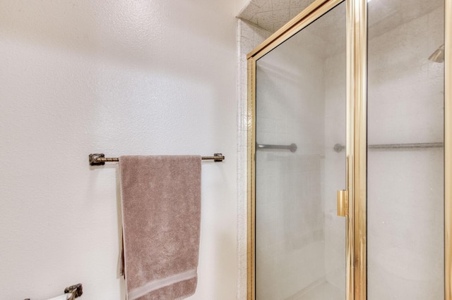 bathroom featuring an enclosed shower