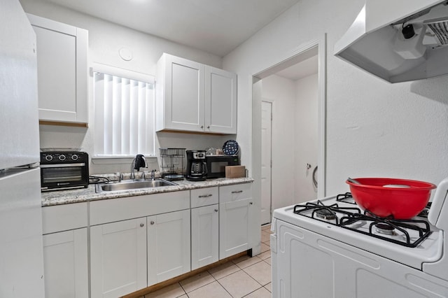 kitchen with white cabinets, light tile patterned floors, sink, white appliances, and ventilation hood