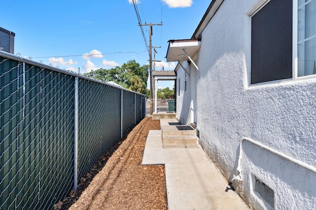 view of property exterior with a patio area