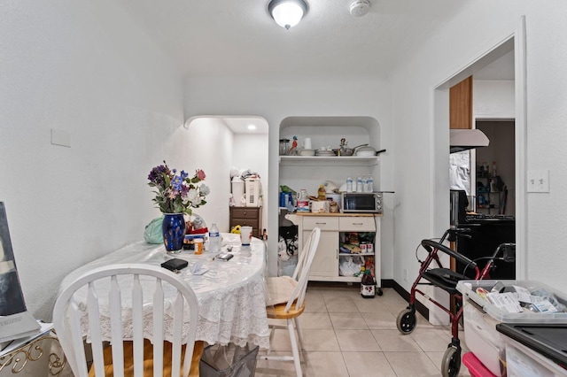 dining area with light tile patterned floors