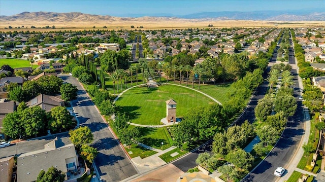 birds eye view of property with a mountain view