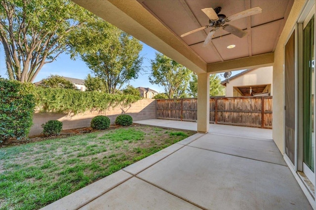 view of patio featuring ceiling fan