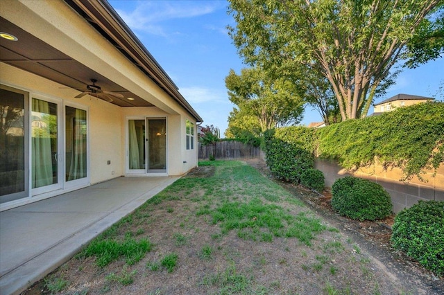 view of yard with ceiling fan