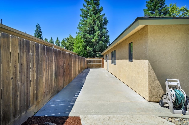 view of property exterior with a patio