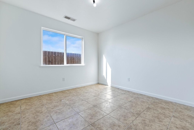 unfurnished room featuring light tile patterned floors