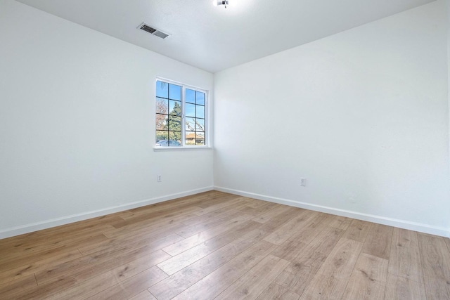 spare room with light hardwood / wood-style floors