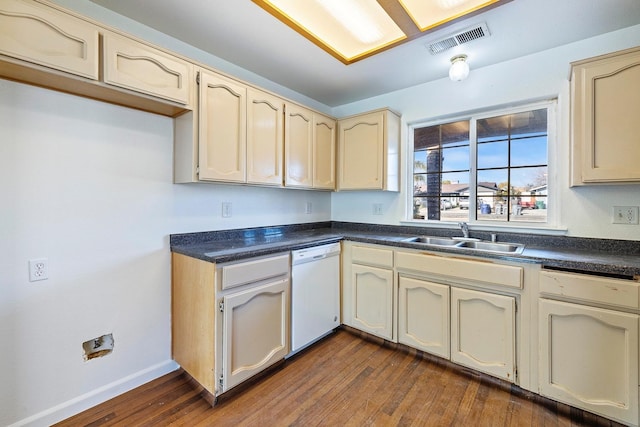 kitchen with cream cabinets, dishwasher, dark hardwood / wood-style floors, and sink