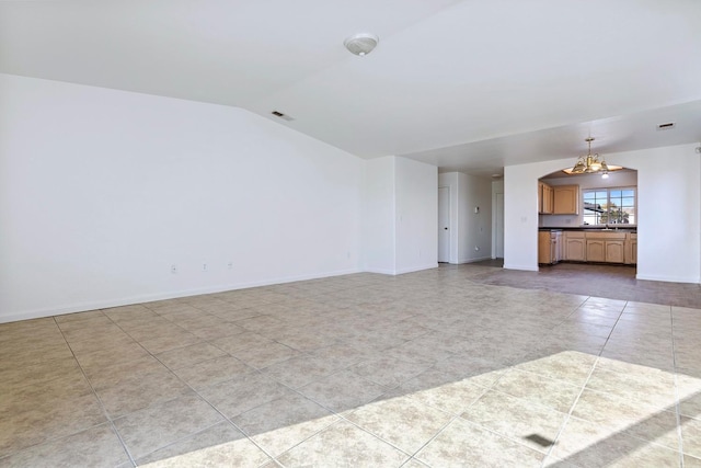 unfurnished living room with light tile patterned flooring, lofted ceiling, and an inviting chandelier