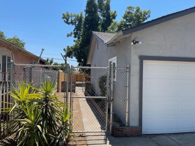 view of side of home with a garage