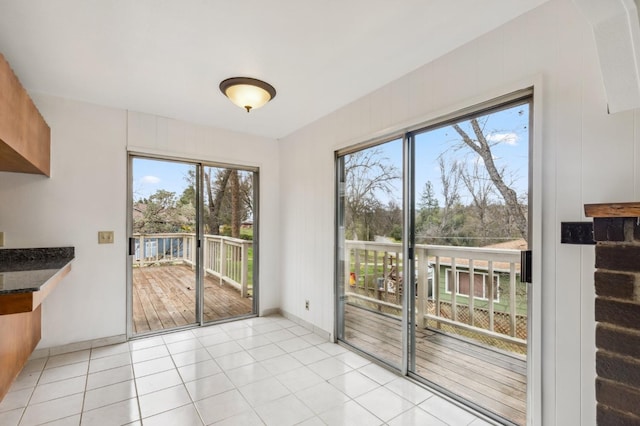 interior space featuring light tile patterned floors and a healthy amount of sunlight