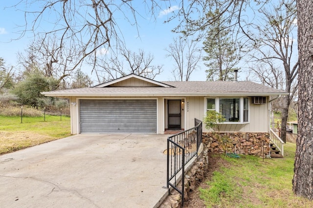 single story home with a front lawn and a garage