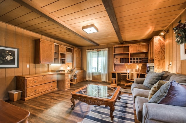 living room with built in desk and wooden walls