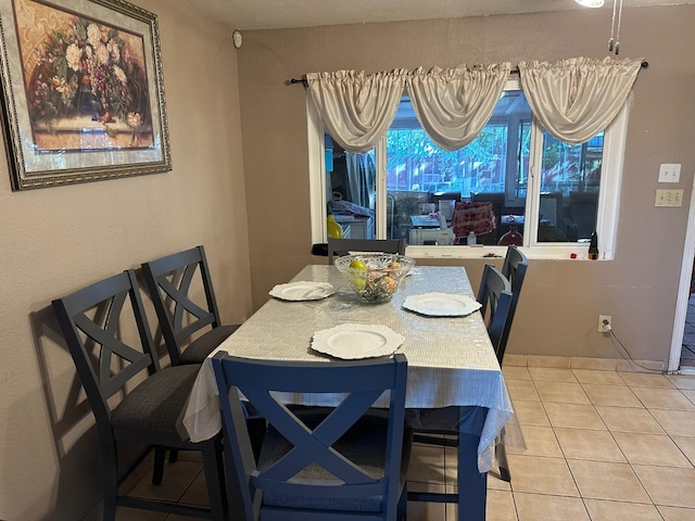 dining area with light tile patterned flooring