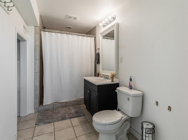 bathroom featuring a stall shower, visible vents, toilet, and tile patterned floors