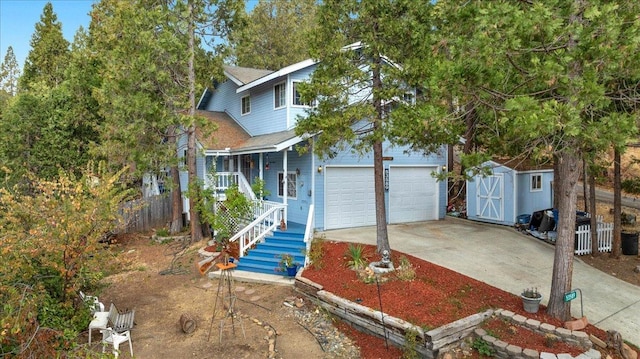 view of front of property with a storage unit, covered porch, and a garage