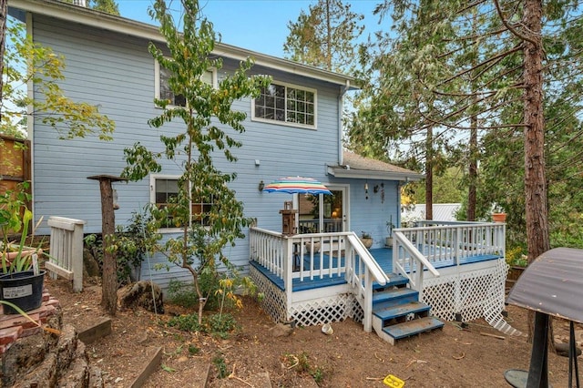 rear view of property with a deck