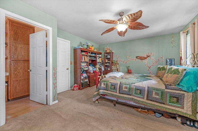 bedroom featuring light wood-type flooring and ceiling fan