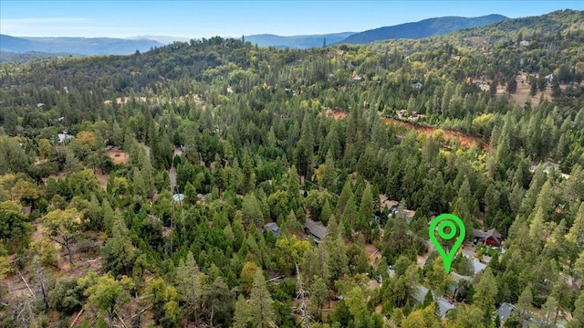 birds eye view of property with a mountain view