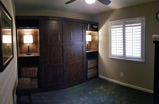 bedroom featuring dark colored carpet and ceiling fan