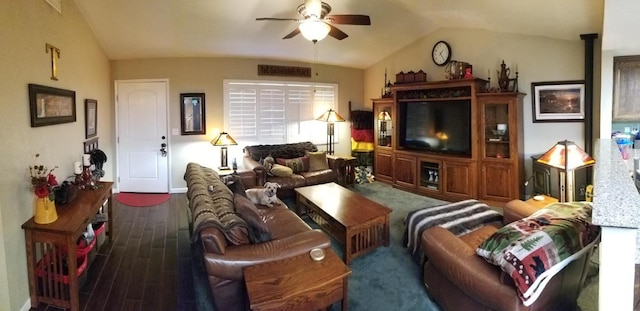 living room featuring vaulted ceiling, dark hardwood / wood-style floors, and ceiling fan