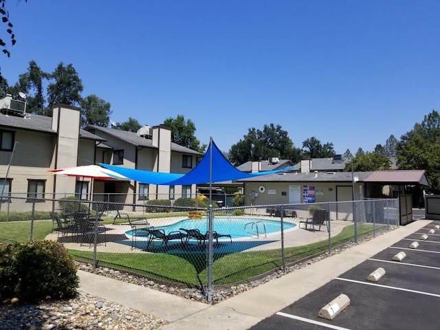 view of swimming pool featuring a patio area