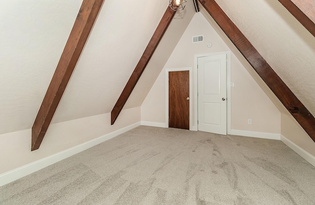 bonus room featuring carpet flooring and vaulted ceiling