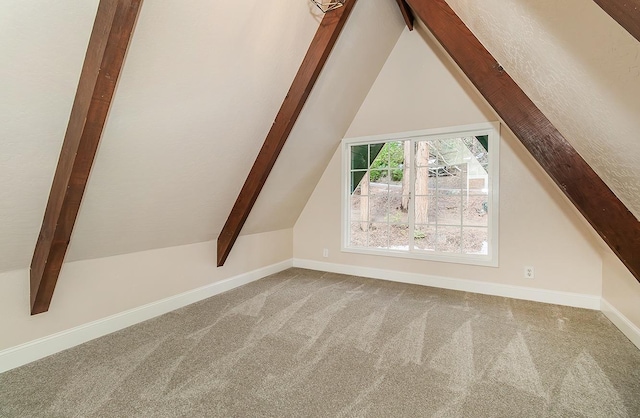 additional living space featuring lofted ceiling and carpet flooring