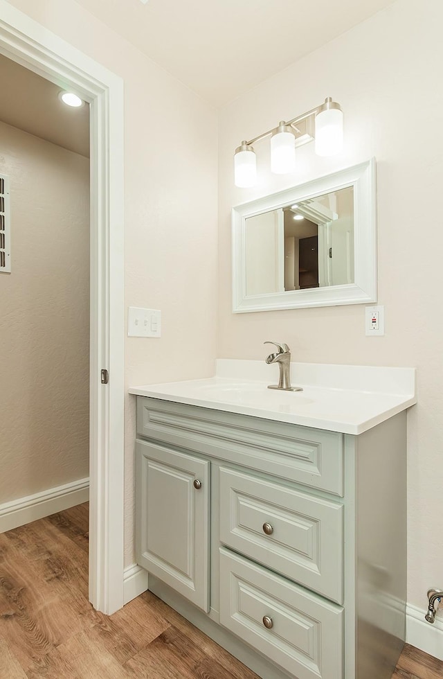 bathroom featuring vanity and wood-type flooring