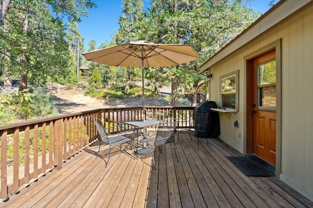 wooden deck with grilling area