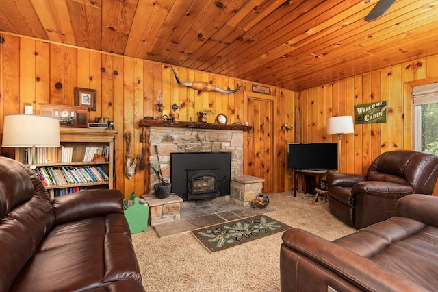 living room featuring wood ceiling, wooden walls, and carpet