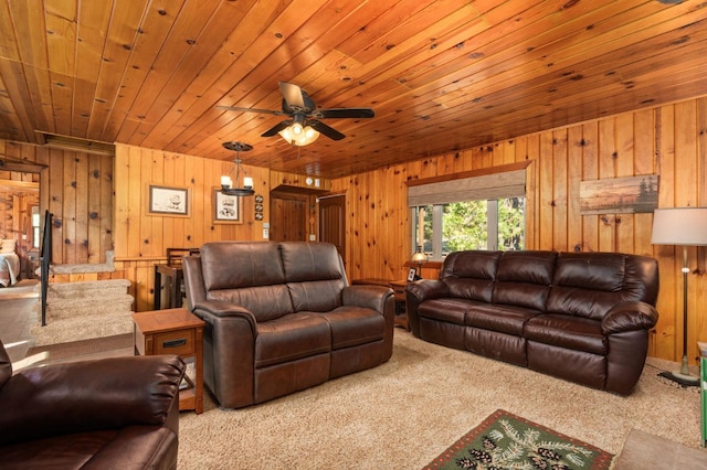 carpeted living room featuring wood ceiling, ceiling fan, and wooden walls