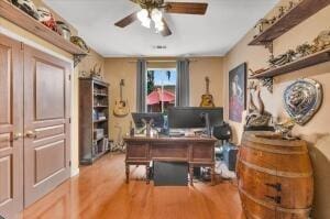 office space with ceiling fan and hardwood / wood-style flooring