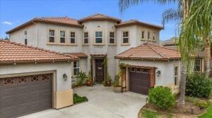 mediterranean / spanish house with a garage