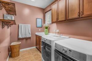 laundry area featuring cabinets and separate washer and dryer