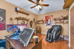 office featuring ceiling fan and hardwood / wood-style flooring