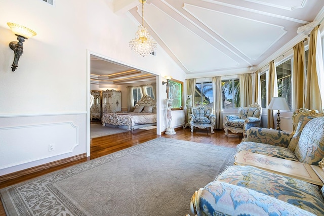 bedroom with dark hardwood / wood-style flooring, beam ceiling, ornamental molding, and a chandelier