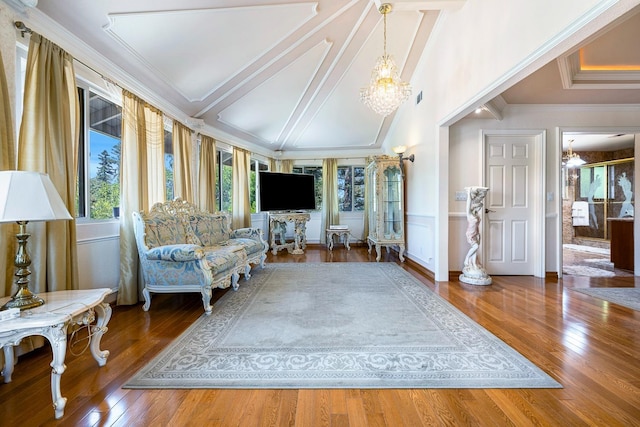 living area with lofted ceiling with beams, crown molding, dark hardwood / wood-style floors, and a notable chandelier