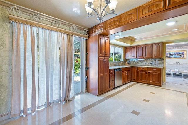 kitchen with crown molding, stainless steel dishwasher, a tray ceiling, pendant lighting, and decorative backsplash