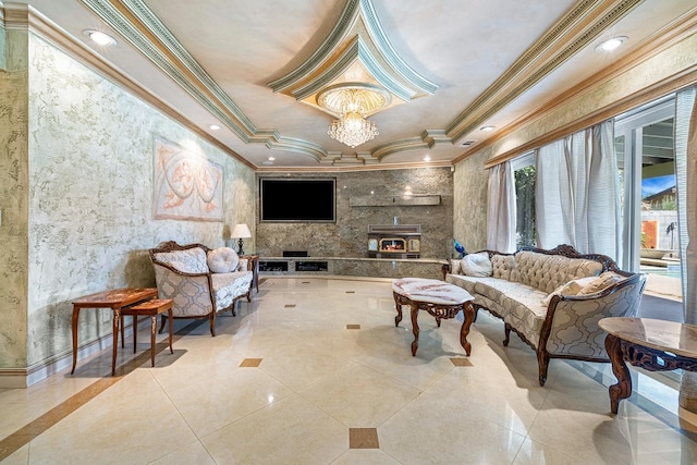 sitting room with ornamental molding, light tile patterned flooring, an inviting chandelier, and a tray ceiling