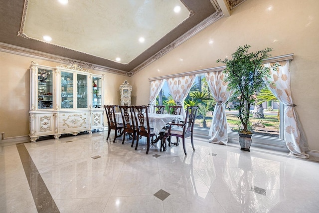 dining space with crown molding and vaulted ceiling