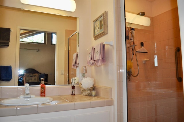 bathroom featuring vanity and a shower with door