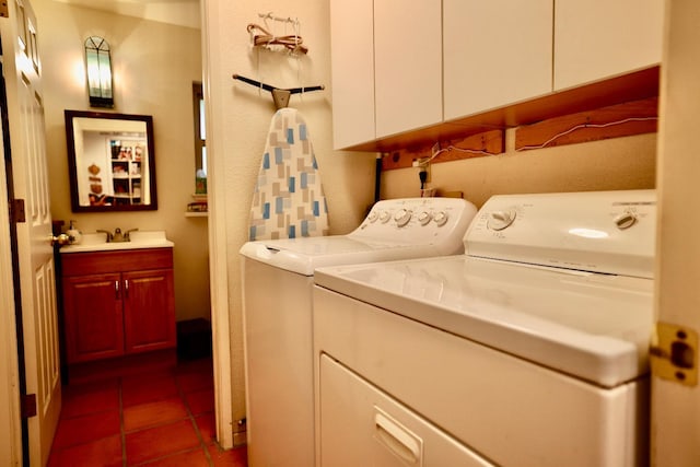 laundry room with sink, tile patterned floors, and washing machine and dryer
