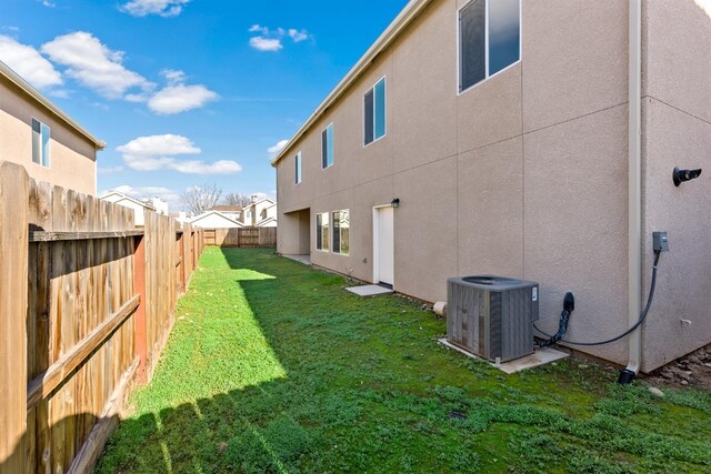 view of yard with central AC unit