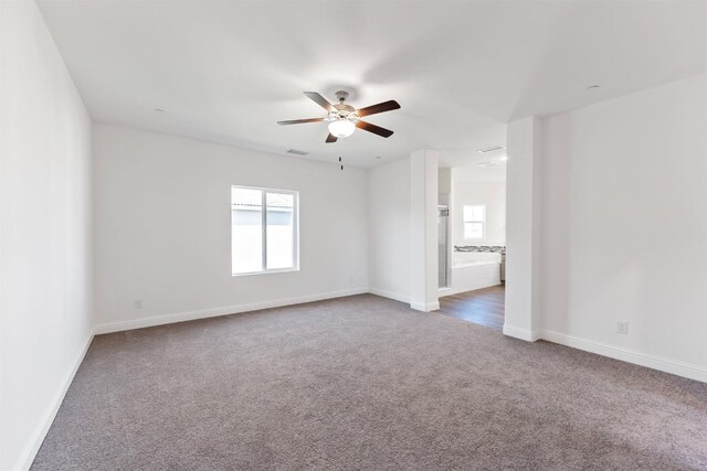 unfurnished room with ceiling fan and carpet floors