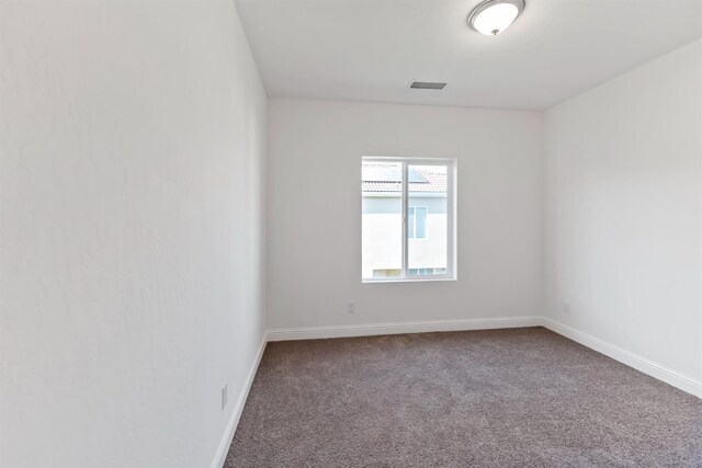 empty room featuring carpet floors